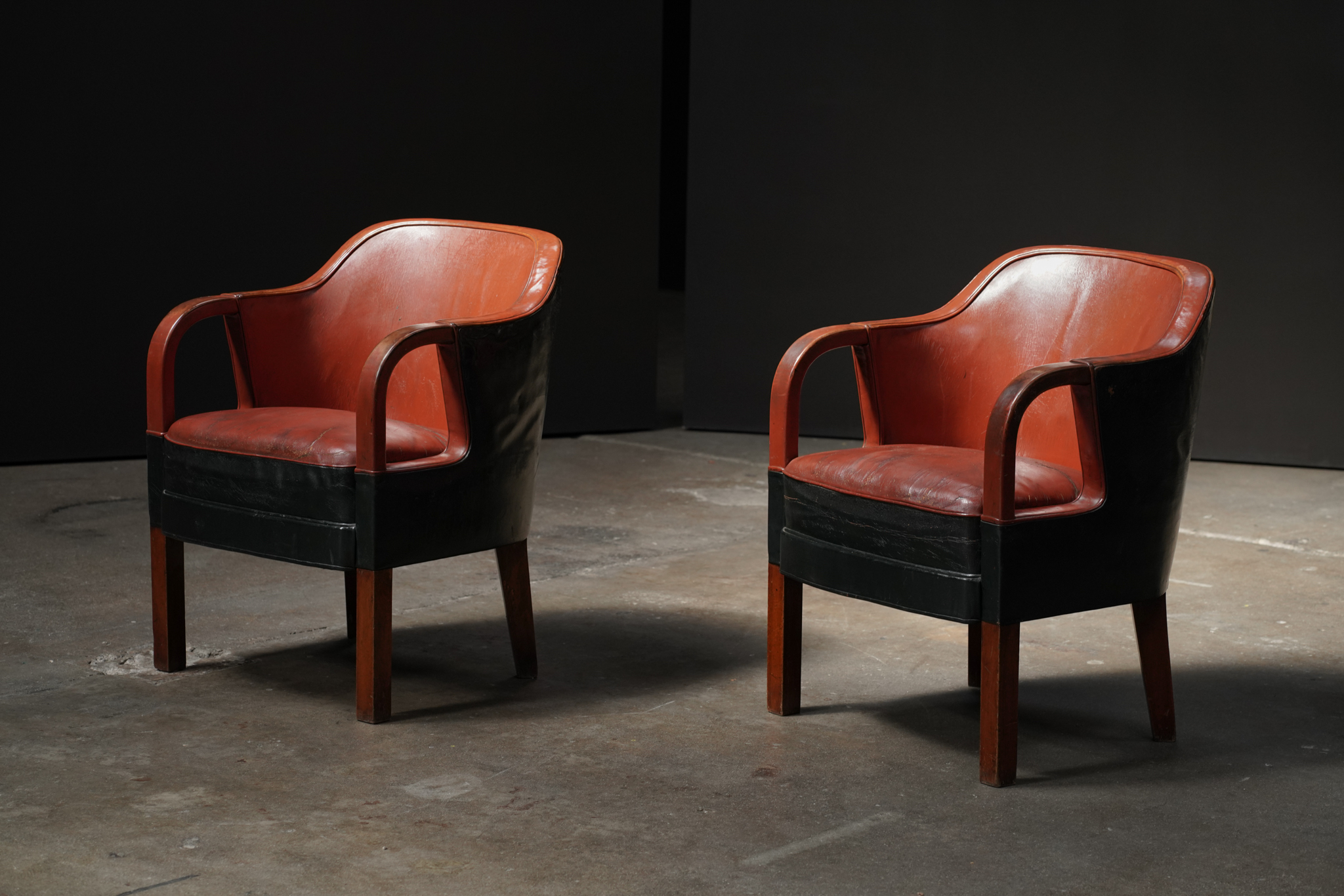 Pair of Leather Silhouette Armchairs